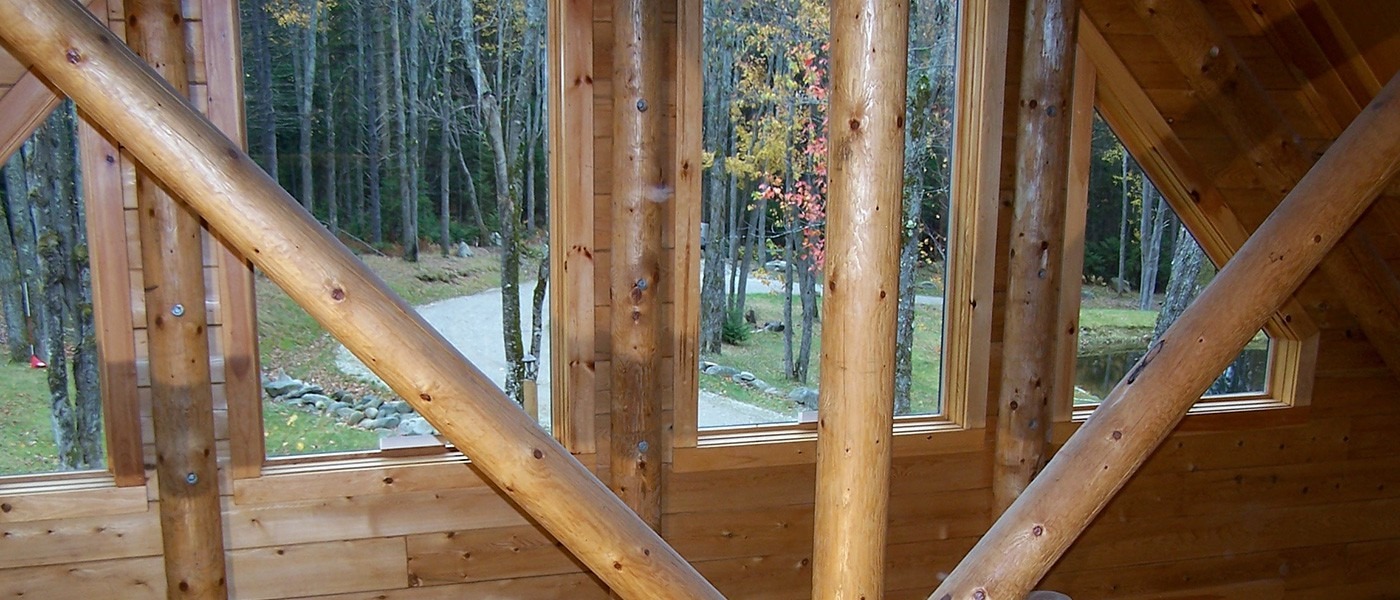 nh_log_cabin_homes_exterior_view_through_windows